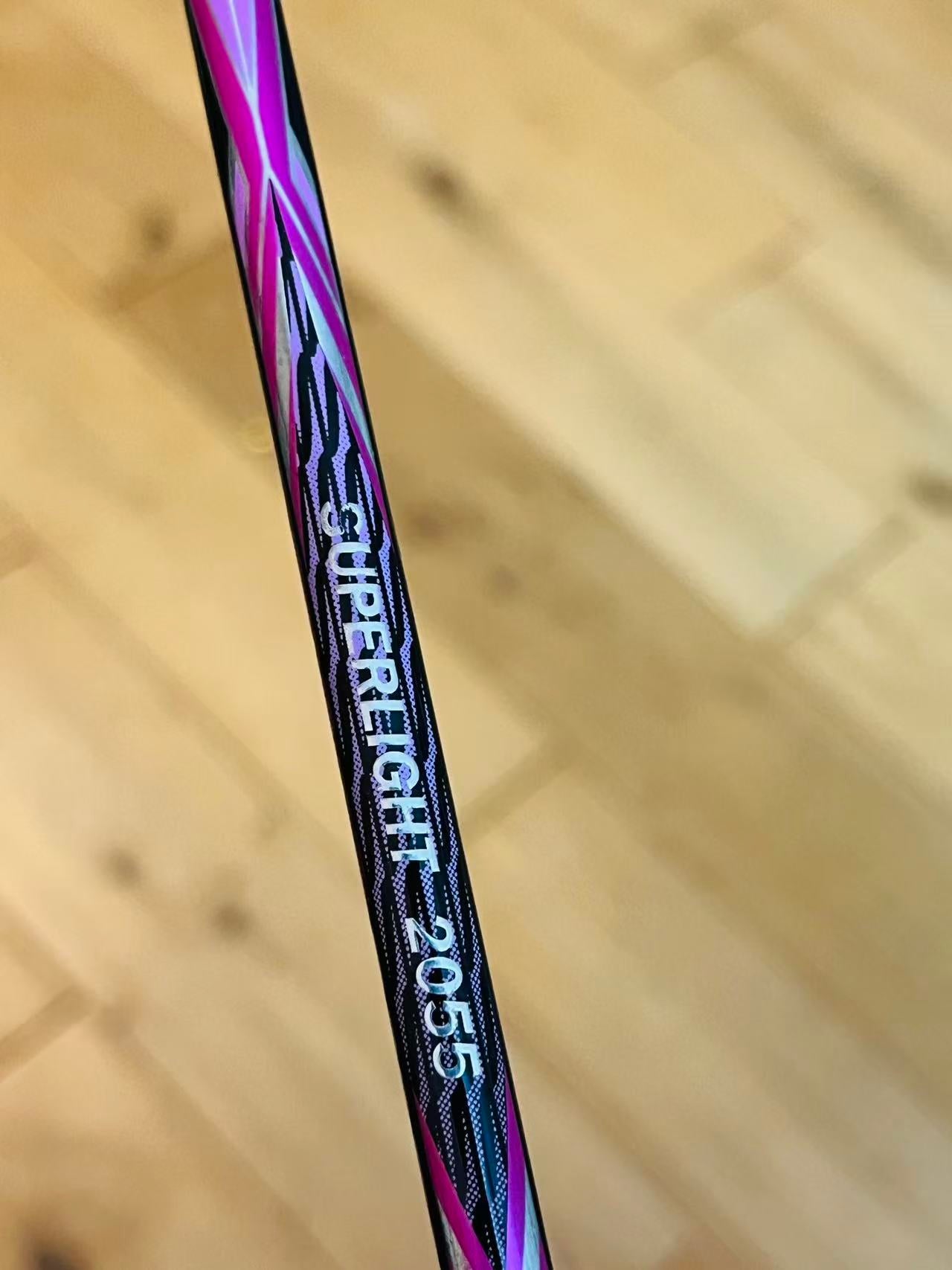 Purple carbon fiber badminton racket strung