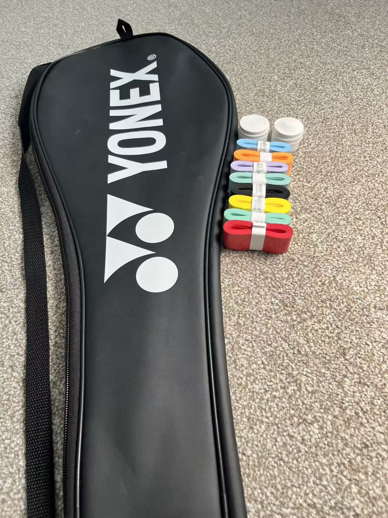One used Yonex badminton racket cover + 8 grips