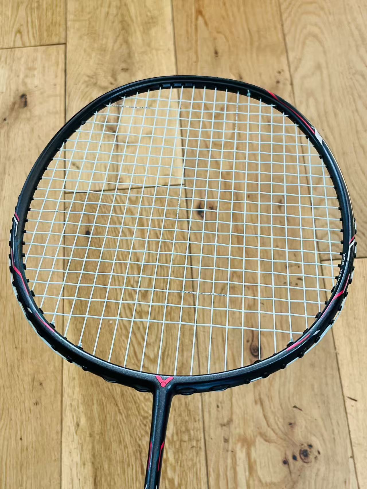 Victor used Thruster BXR badminton racket strung 5U 26lbs