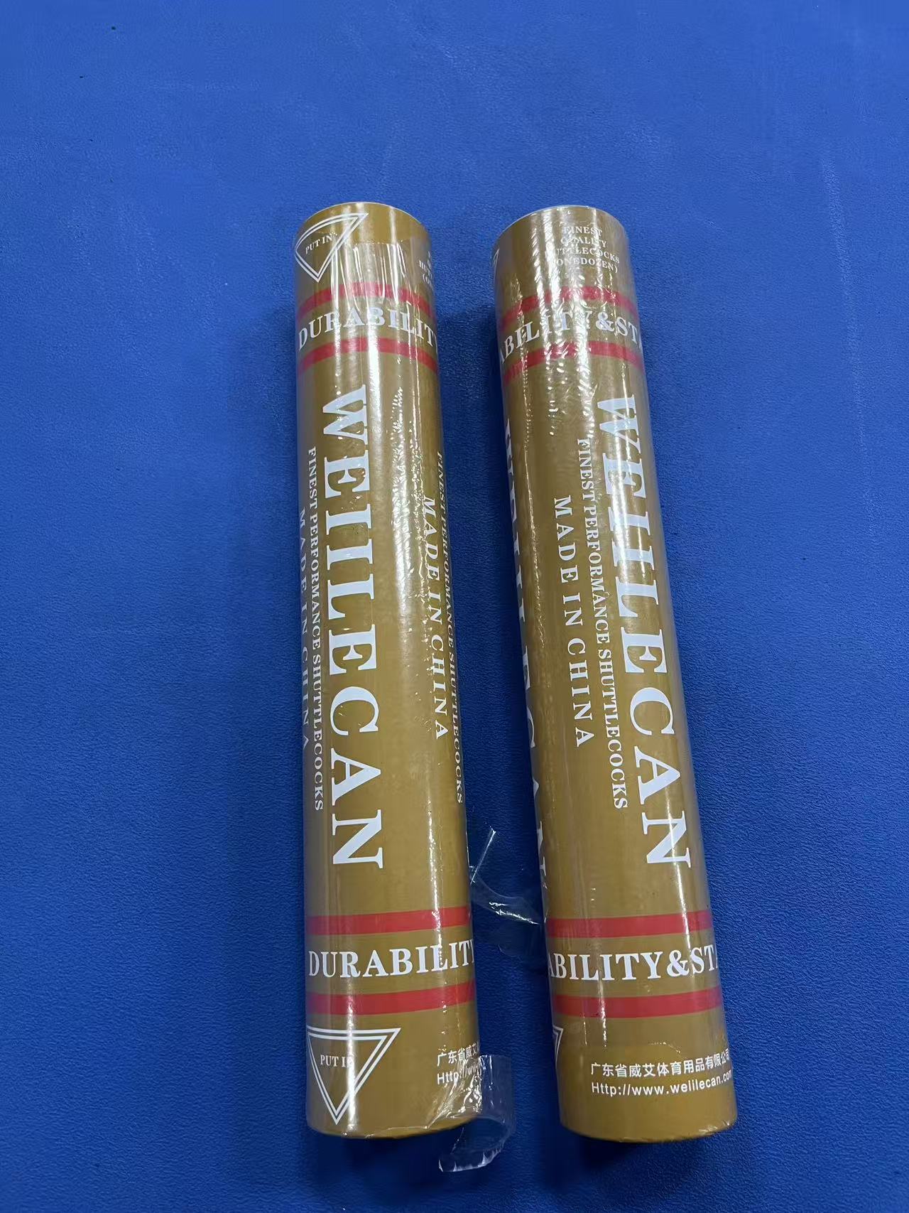 Two buckets of duck feather shuttlecocks