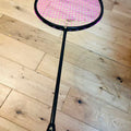 The pure black carbon fiber badminton racket is strung  25 lbs