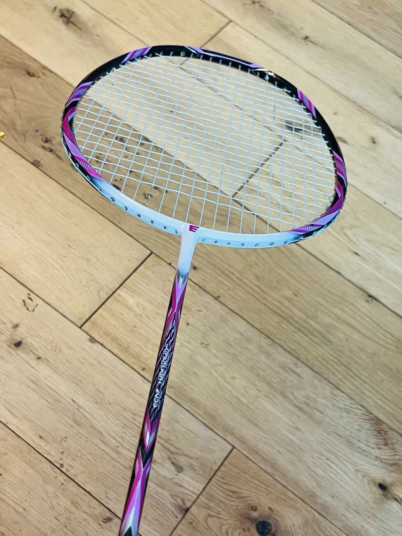 Purple carbon fiber badminton racket strung