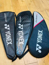One used Yonex badminton racket cover + 8 grips